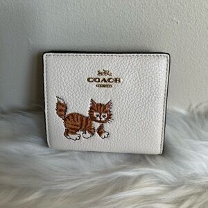 Coach Snap White Pebble Leather Wallet with Playful Kitten Design
